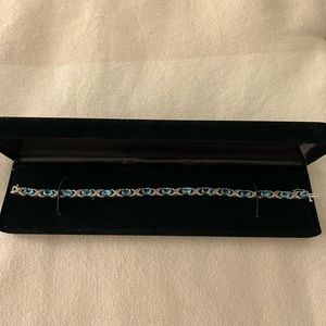 Blue Topaz and Diamond Sterling Silver X’s and O’s bracelet